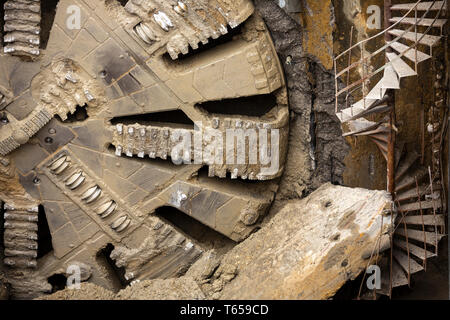 Tunnel Boring Machine front head element is seen on a subway station under construction. Stock Photo