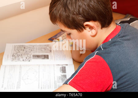 boy doing homework Stock Photo