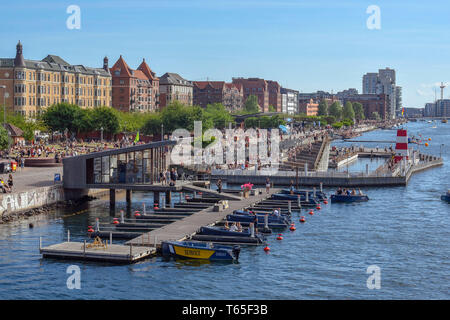 Tourists and visitors enjoy a warm and sunny summer day  in the Islands Brygge Harbour Bath in the inner harbour, Copenhagen, Denmark 05/06/2018    Ph Stock Photo