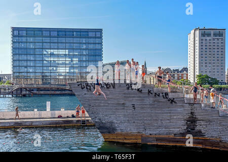 Tourists and visitors enjoy a warm and sunny summer day  in the Islands Brygge Harbour Bath in the inner harbour, Copenhagen, Denmark 05/06/2018    Ph Stock Photo