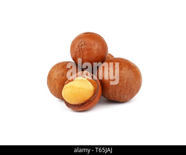 Close up group of several unshelled macadamia nuts and one open kernel isolated on white background, low angle side view Stock Photo