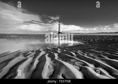 The slightly leaning Talacre Lighthouse and beach near Prestatyn on the North Wales coast Stock Photo