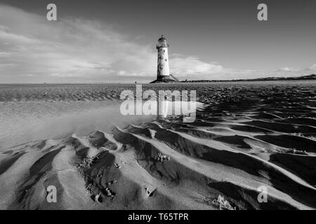 The slightly leaning Talacre Lighthouse and beach near Prestatyn on the North Wales coast Stock Photo