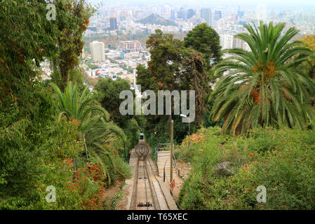 Funicular Riding up to the Hilltop of Cerro San Cristobal with Stunning Santiago City View in the Backdrop, Chile Stock Photo