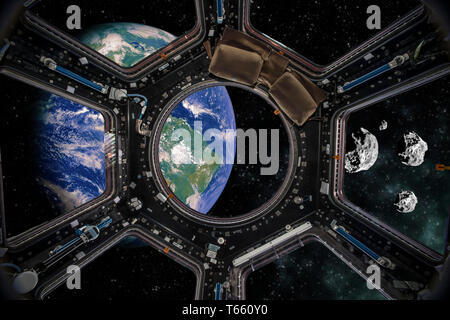 Earth and space rocks view from a Spacecraft. Elements of this image furnished by NASA. Stock Photo