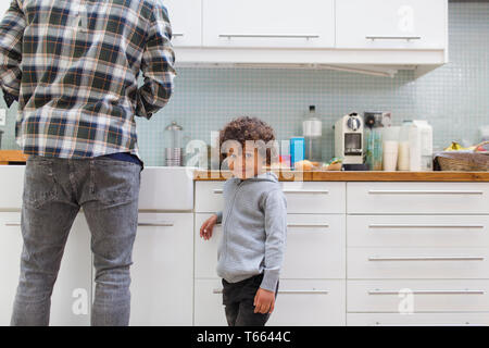Portrait cute boy in kitchen with father Stock Photo