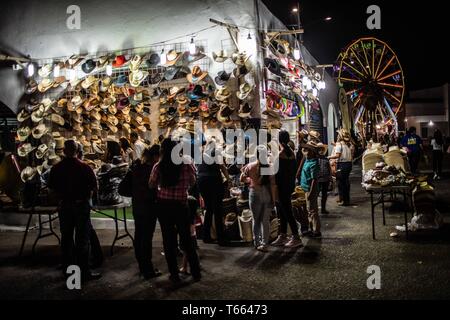 Varias personas curiosas por la compra / venta de sombreros de la cultura vaquera en un stand de la feria popular ganadera más grande de sonora conocida como Expogan Sonora.  domingo 29 abril 2019. (Photo:LuisGutierrez/NortePhoto) Stock Photo