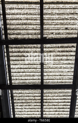 old corrugated polycarbonate roof with rusty construction Stock Photo