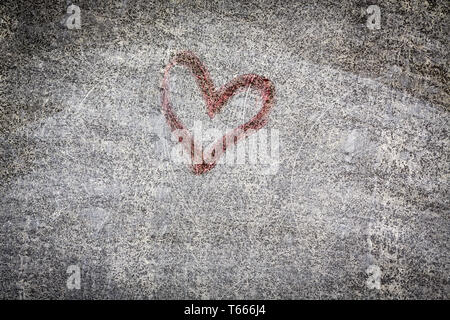 red heart painting on a grungy wall Stock Photo