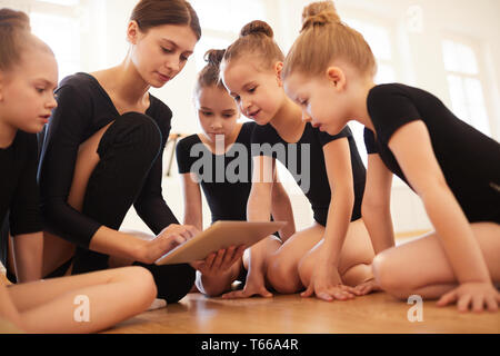 Watching Videos in dance Class Stock Photo