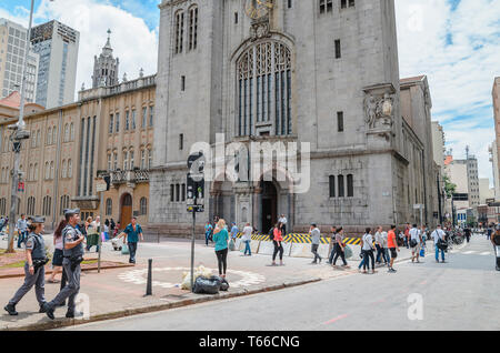 Sao Paulo SP, Brazil - February 27, 2019: People on the streets in front of Monastery of Sao Bento. Historical church on downtown. Stock Photo