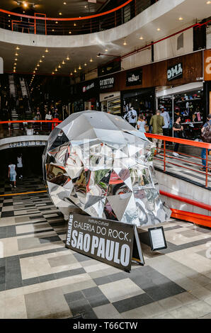 Sao Paulo SP, Brazil - February 27, 2019: Giant metallic skull in front of Galeria do Rock (Rock gallery). Mall with stores that sells products with u Stock Photo