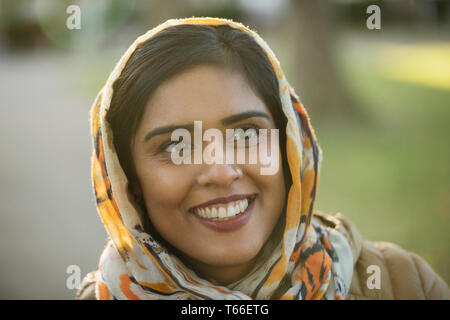 Portrait smiling, happy Muslim woman wearing hijab Stock Photo