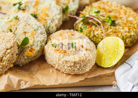 Vegan cutlets (burgers) from lentils, chickpeas and beans. Healthy vegan food concept, detox dish, plant based diet. Stock Photo