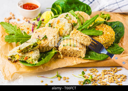 Vegan cutlets (burgers) from lentils, chickpeas and beans. Healthy vegan food concept, detox dish, plant based diet. Stock Photo