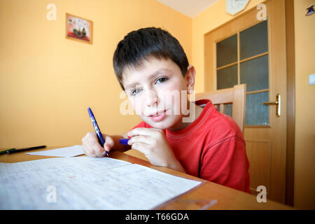 boy doing school homework Stock Photo