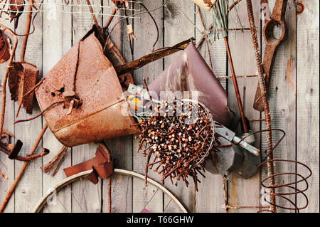 Still-life of rusty metal items on wooden backgrou Stock Photo