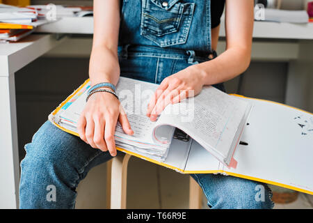 Young female college student with binder studying Stock Photo