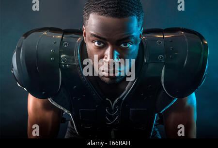 Portrait confident, tough football player wearing pads Stock Photo
