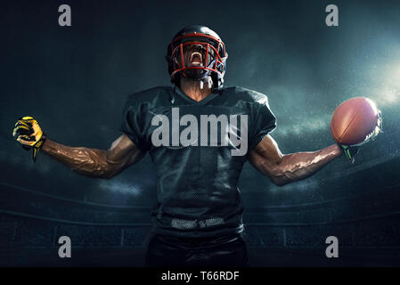 Muscular football player cheering Stock Photo