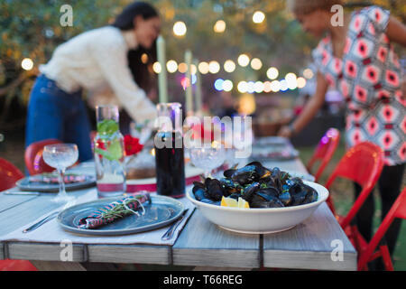 Mussels on dinner garden party table Stock Photo