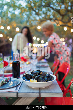Mussels on dinner garden party table Stock Photo