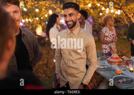 Friends talking at dinner garden party Stock Photo