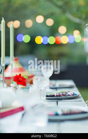 Placesettings on dinner garden party table Stock Photo
