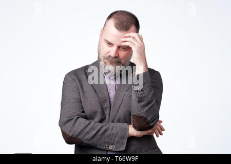 Mature caucasian man thinking about his life problem. Stock Photo