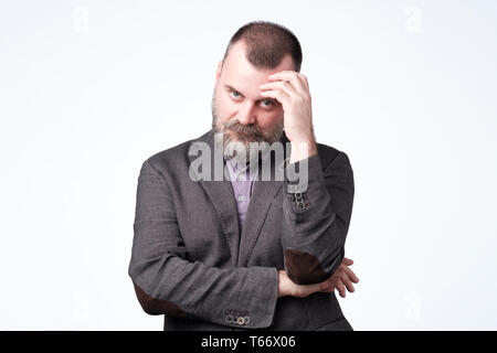 Mature caucasian man thinking about his life problem. Stock Photo