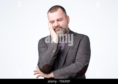 Mature caucasian man thinking about his life problem. Stock Photo