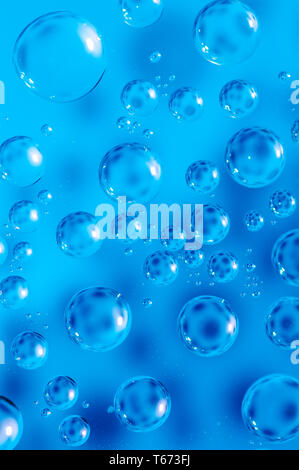 Macro air bubbles in water on a blue background, healthcare or ecology concept Stock Photo