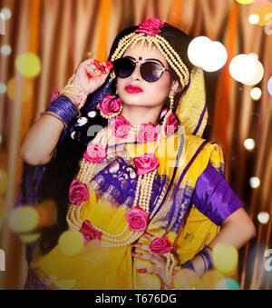 Indian wedding. Morning preparations . Portrait of attractive Hindu bride wearing sunglass Stock Photo