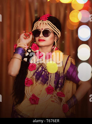 Indian wedding. Morning preparations . Portrait of attractive Hindu bride wearing sunglass Stock Photo