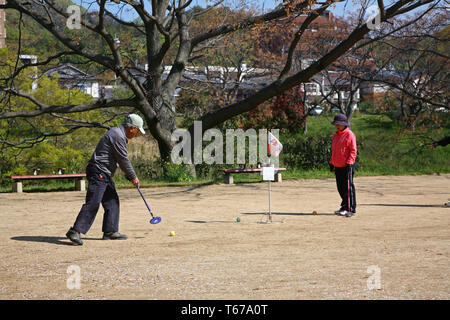 senior citizens playing grand golf in Japan Stock Photo