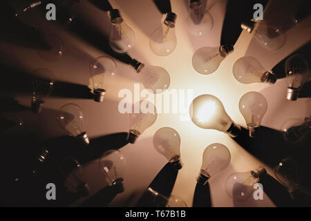 Flat lay picture of switch off light bulbs except one turned on. Idea or leadership concept. 3D rendering illustration. Stock Photo