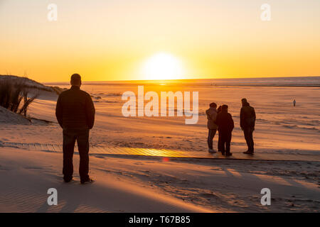 North Sea island Juist, East Frisia, Beach, people on the beach, at sunset, Lower Saxony, Germany, Stock Photo