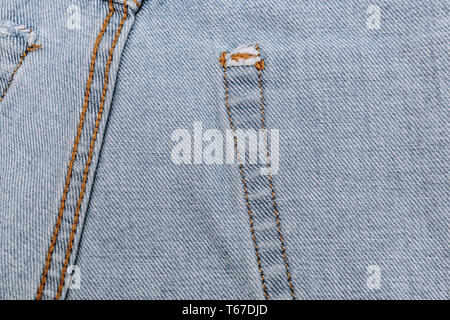 Jeans inside with seam closeup texture. jeans denim texture and background. Wrong side of black jeans fabric. Selectibe fokus, place for text. Stock Photo