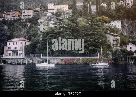 Villages on the hills in the evening. Old Village on Lake Como, Italy.Como lake is the most beautiful city around the lake.This is the most beautiful  Stock Photo