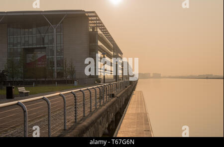 Newham Dockside at sunrise on misty day Stock Photo