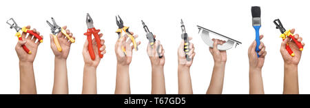Male hands with different repair tools on white background Stock Photo