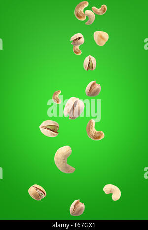 Falling nuts on color background Stock Photo