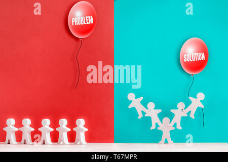 Several wooden figures in different situations. Teamwork concept. Brainstorm. New ideas. Non-standard approach to solving problems. Stock Photo