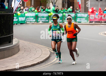 Edneusa de Jesus Santos Dorta with her guide runner, competing in the World Para 2019 London Marathon.  She went on to finish 2nd, in a time of 03:13:17 Stock Photo