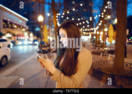 Fashion girl walking in a evening city Stock Photo
