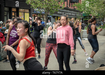 Women take part in an outdoor exercise class as part of the Car-Free Earth Day initiative in the Flatiron neighborhood of New York on Saturday, April 27, 2019 (Â© Richard B. Levine) Stock Photo