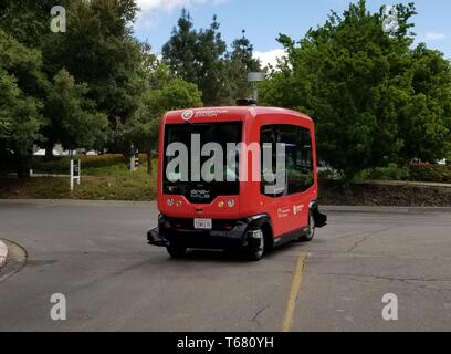 Driverless shuttle from self driving vehicle company Easy Mile driving through the Bishop Ranch office park in San Ramon, California, the first fully autonomous shuttle bus authorized to drive on public roads in the State of California, April 17, 2019. () Stock Photo