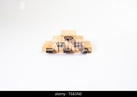 Stack of wooden pendrive memory usb isolated on white background. Stock Photo