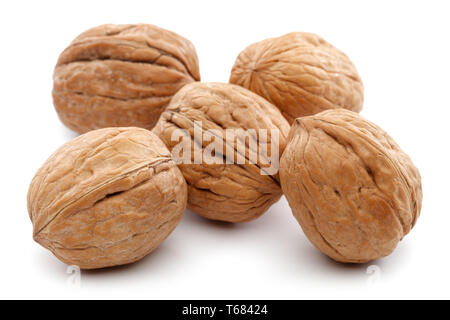Heap of whole walnuts isolated on white background Stock Photo
