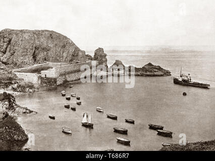 Late 19th Century view of Creux Harbour on Sark, an island in the Channel Islands,  Crown dependencies in the southwestern English Channel, off the coast of Normandy, France. It is a royal fief, which forms part of the Bailiwick of Guernsey, with its own set of laws based on Norman law and its own parliament. It is still one of the few remaining places in the world where cars are banned from roads and only tractors and horse-drawn vehicles are allowed. Stock Photo